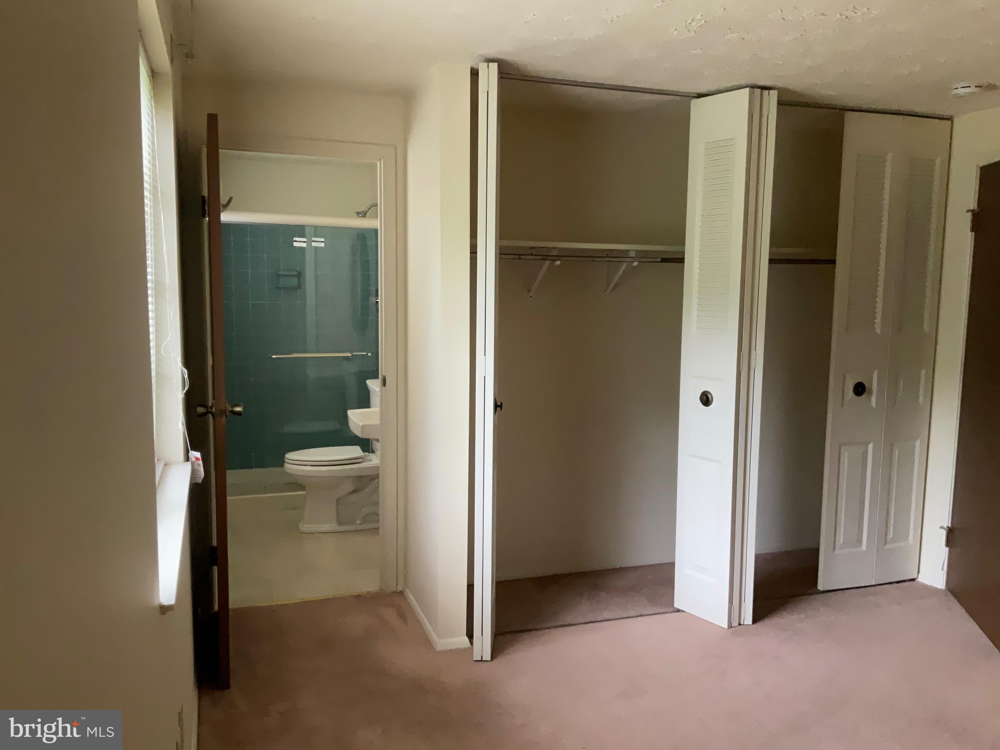 9218 Briarchip Street Laurel, MD 20708 - Photo 27 of 38 a bathroom view of a toilet and a shower
