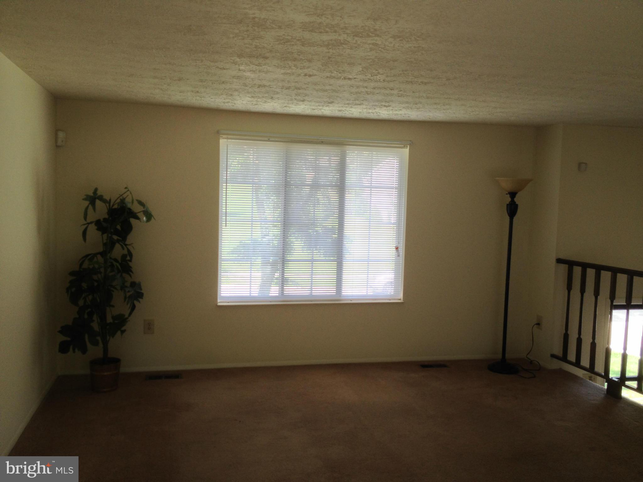 9218 Briarchip Street Laurel, MD 20708 - Photo 3 of 38 an empty room with a window