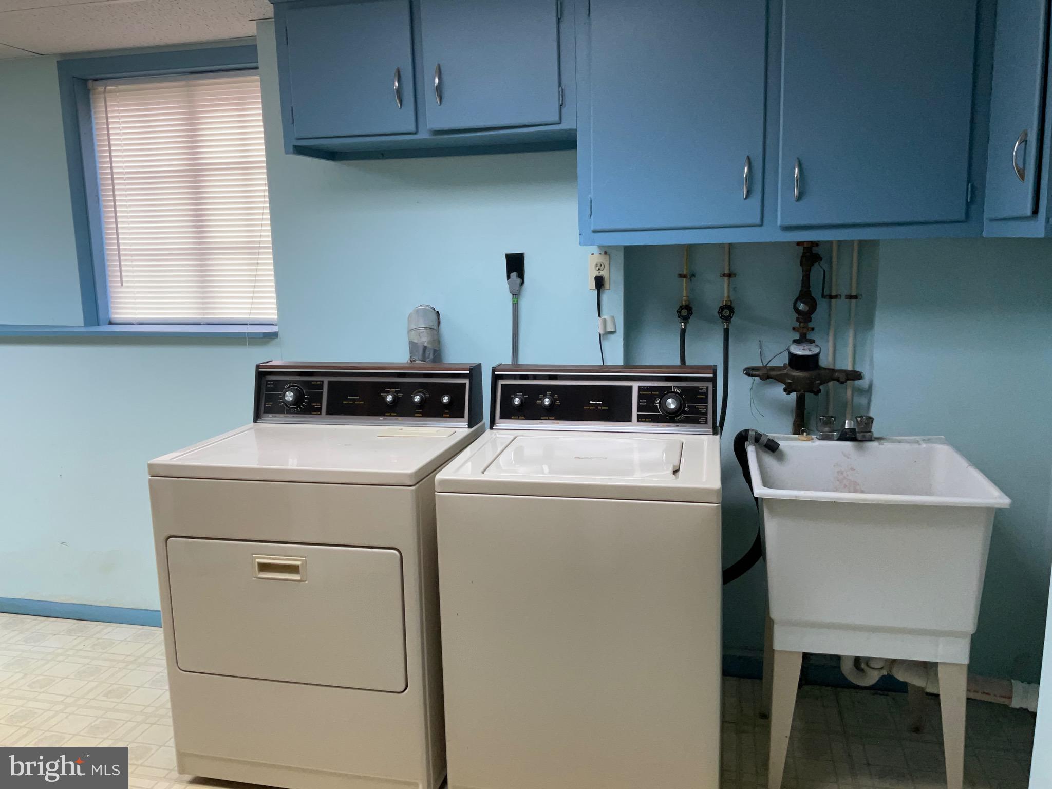 9218 Briarchip Street Laurel, MD 20708 - Photo 34 of 38 a utility room with dryer washer and a sink