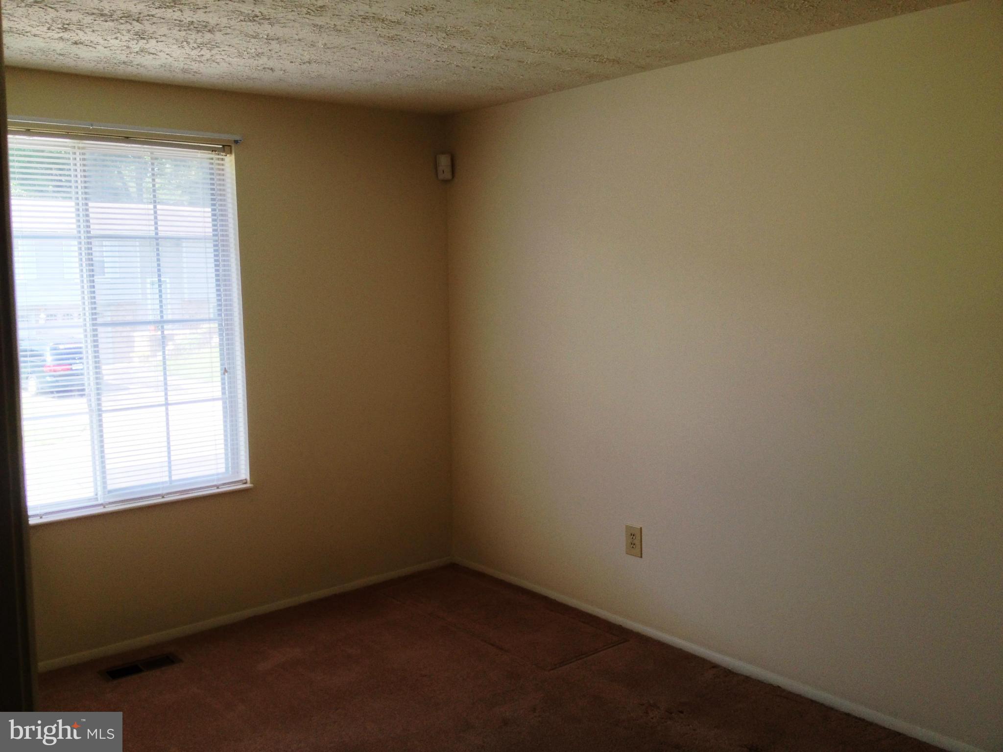 9218 Briarchip Street Laurel, MD 20708 - Photo 7 of 38 an empty room with a window