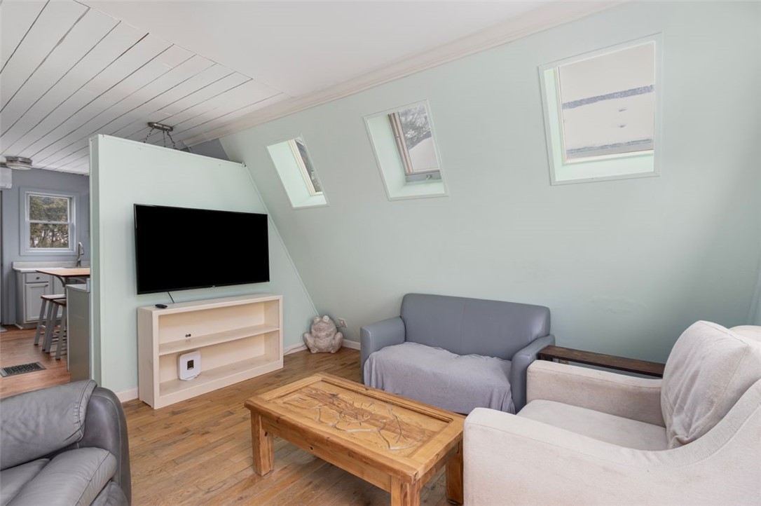 27 Ricks Road Charlestown, RI 02813 - Photo 15 of 38 Living room skylights for natural light and looking towards kitchen