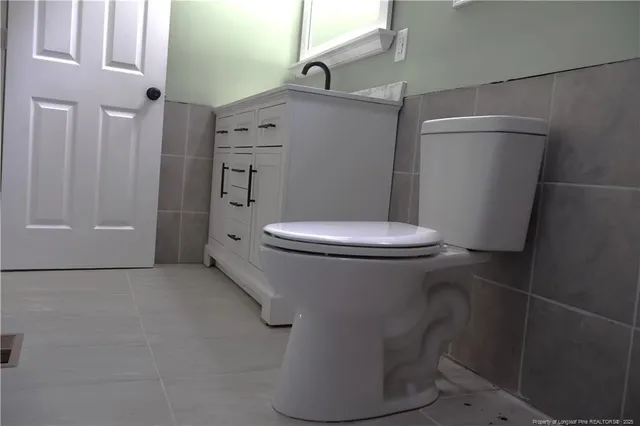 a view of a house with a backyard and a garage