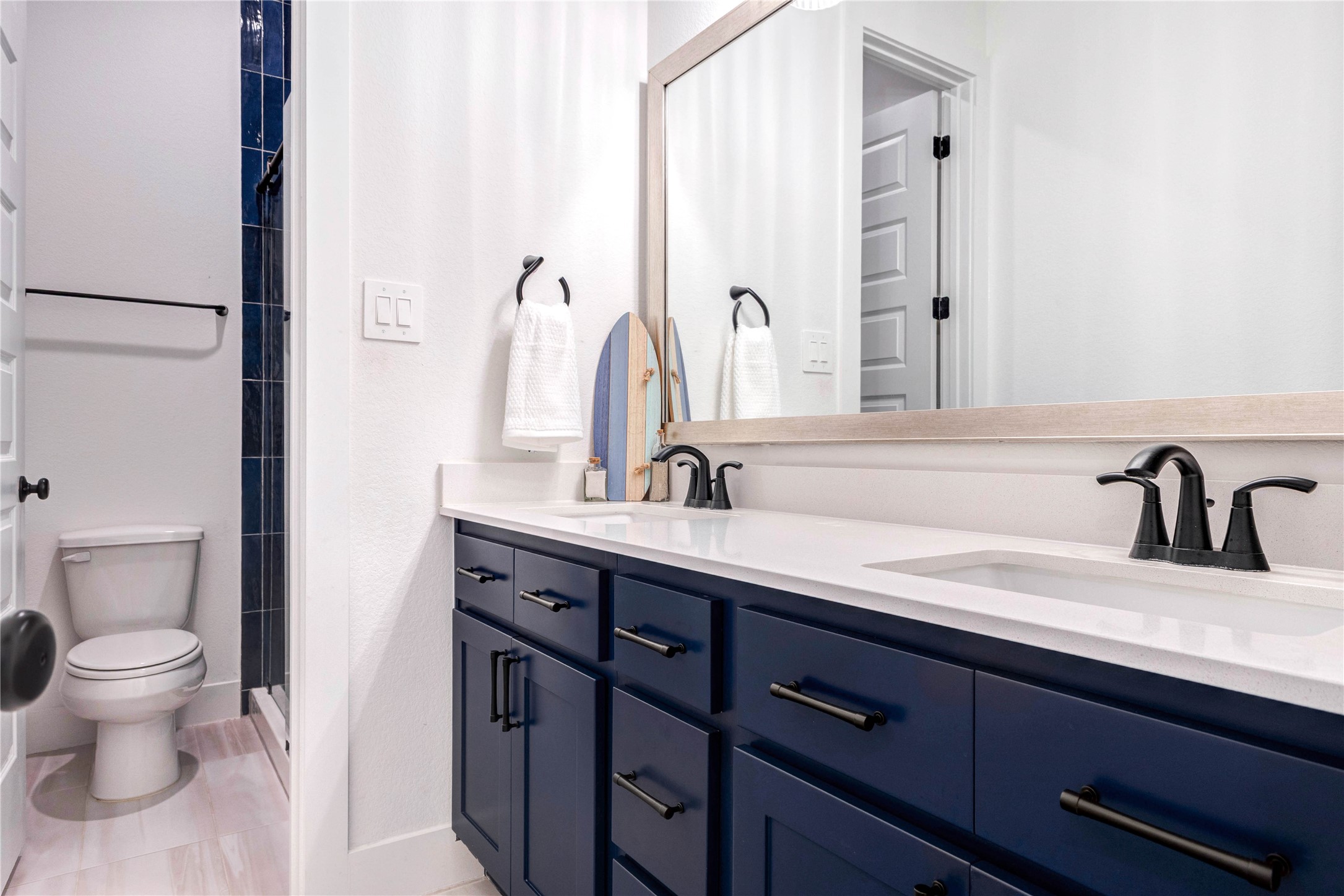 4510 Windmill Lndg Lane Fulshear, TX 77441 - Photo 20 of 48 a bathroom with a double vanity sink and a toilet