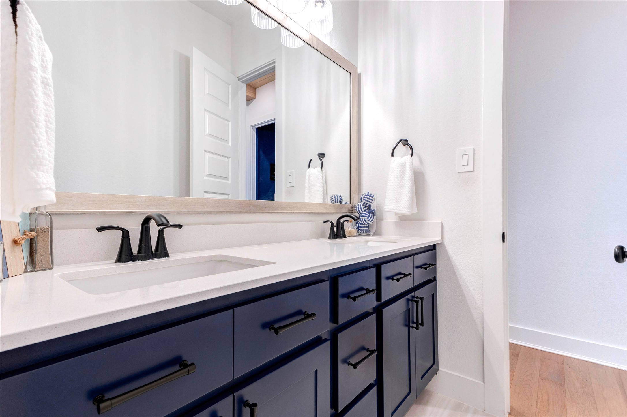 4510 Windmill Lndg Lane Fulshear, TX 77441 - Photo 21 of 48 a bathroom with a double vanity sink and a mirror