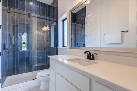 a white bath tub sitting next to a white sink