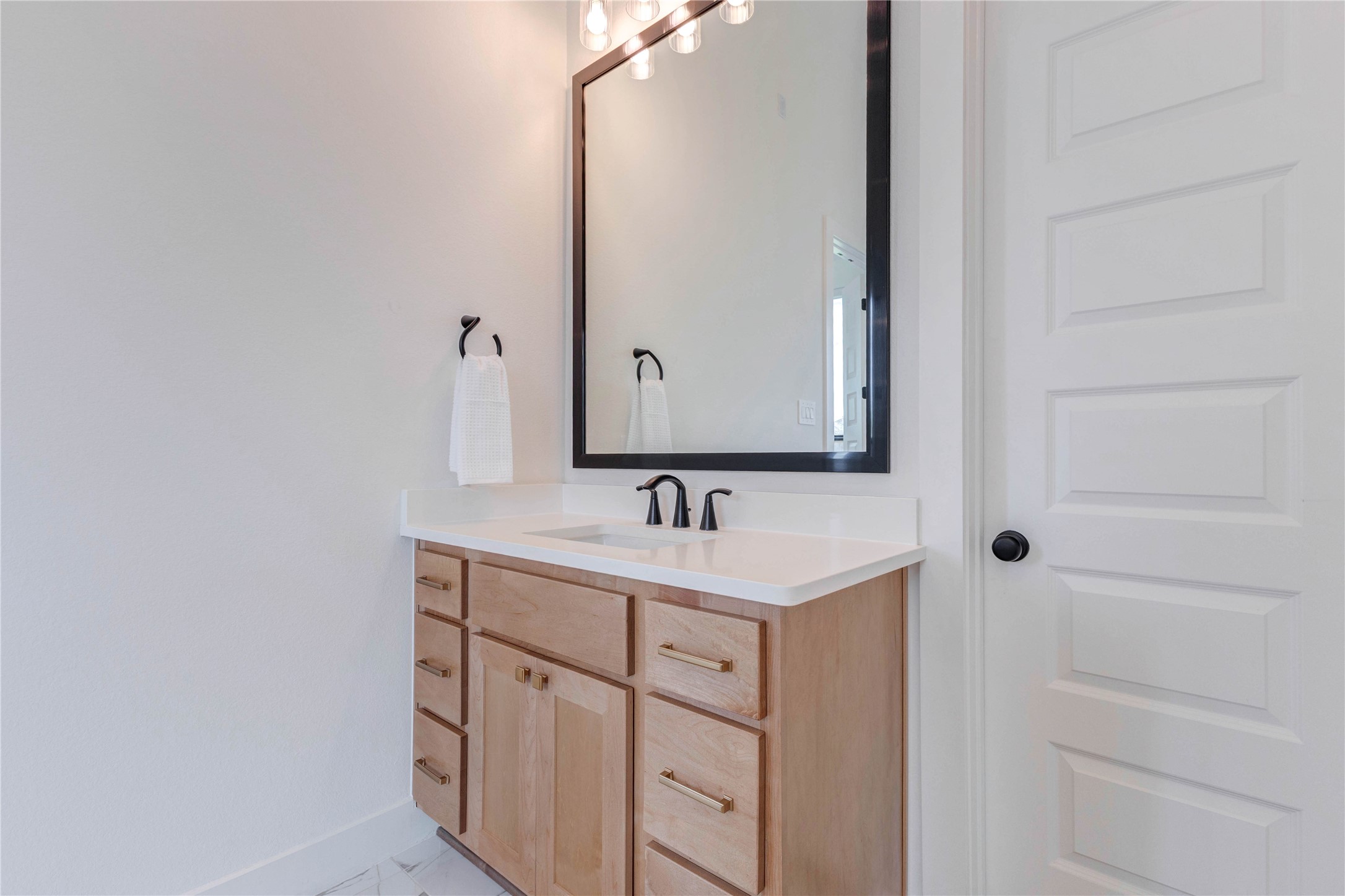 4510 Windmill Lndg Lane Fulshear, TX 77441 - Photo 35 of 48 a bathroom with a sink and a mirror