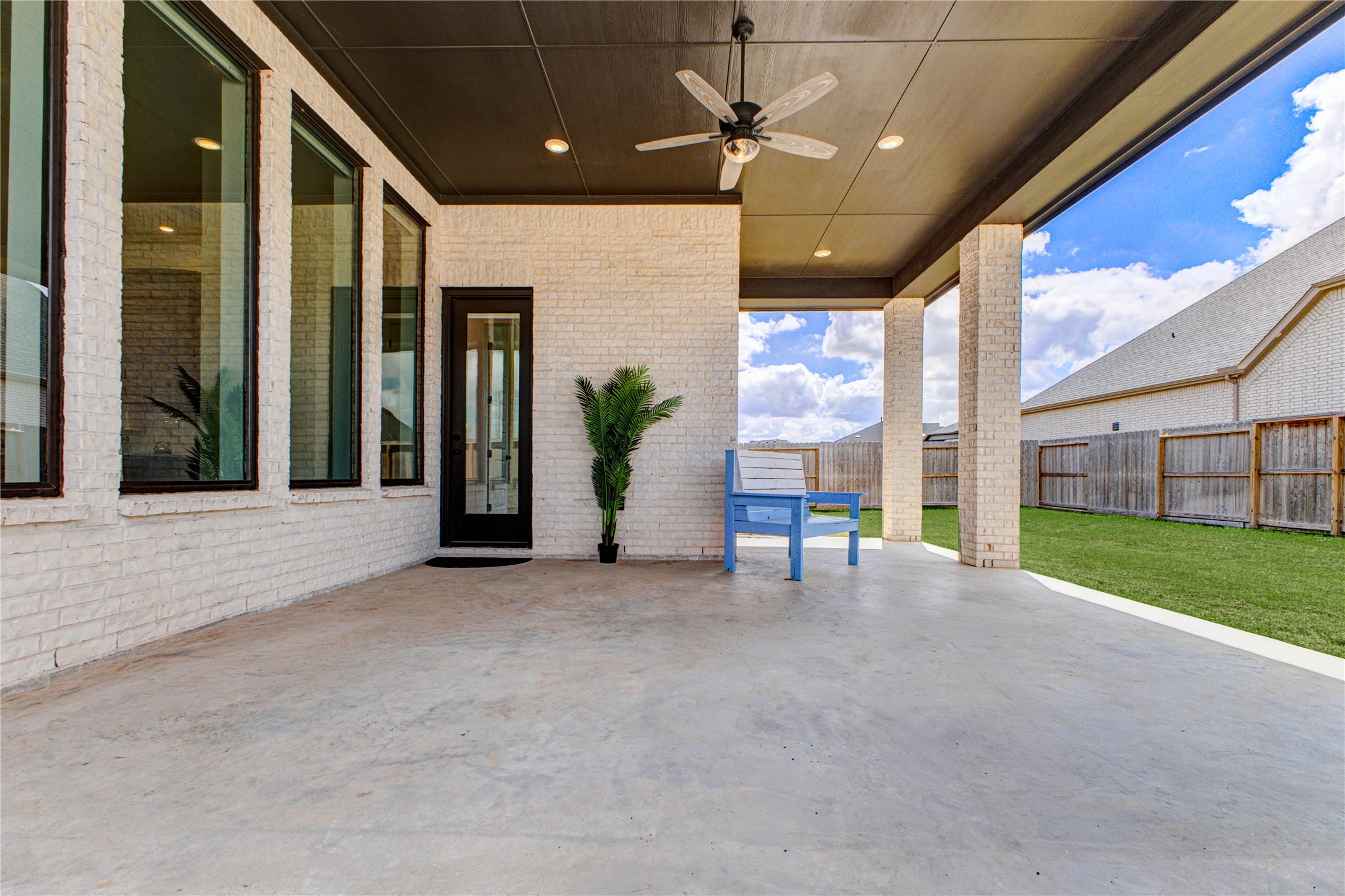 4510 Windmill Lndg Lane Fulshear, TX 77441 - Photo 43 of 48 a view of a porch with a table and chairs