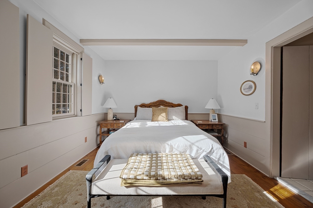 2 Marie Drive Blackstone, MA 01504 - Photo 20 of 42 a bedroom with a bed and wooden floor