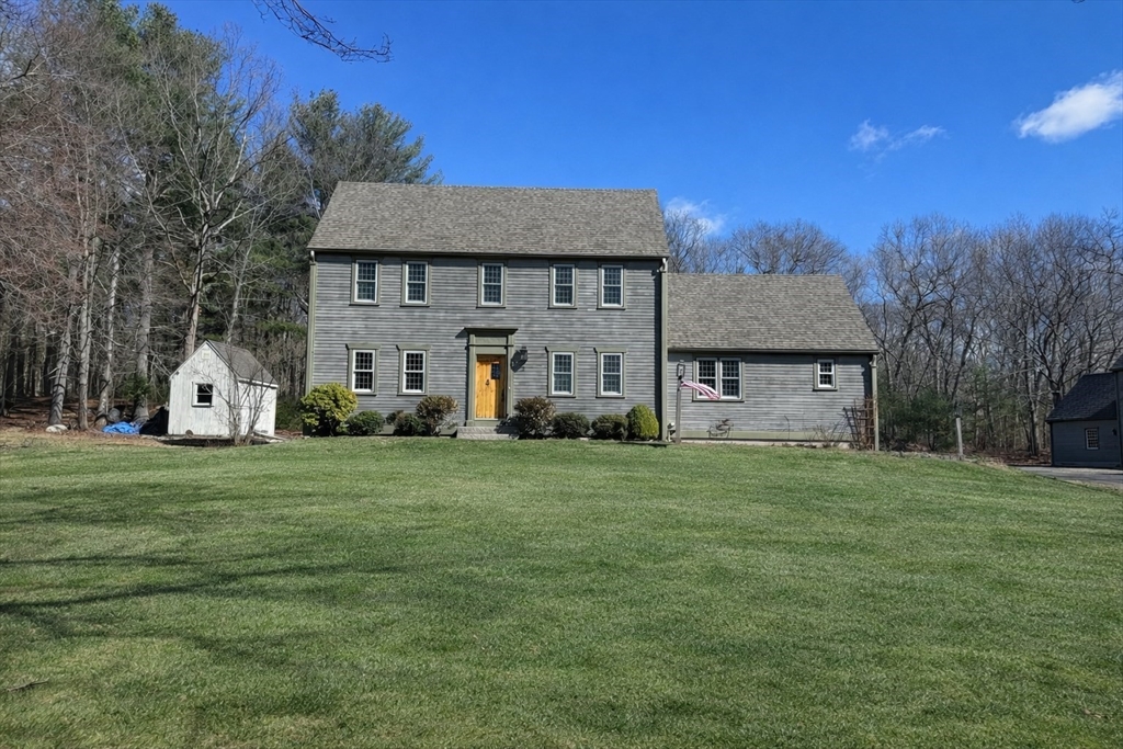 2 Marie Drive Blackstone, MA 01504 - Photo 2 of 42 a front view of a house with a yard and trees