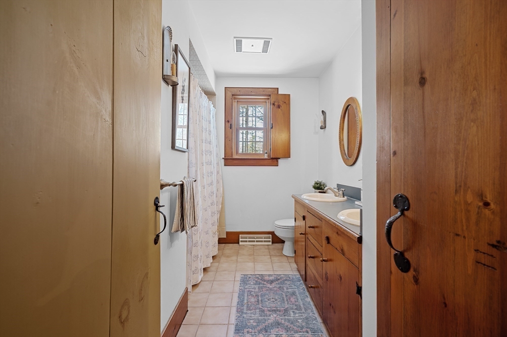2 Marie Drive Blackstone, MA 01504 - Photo 22 of 42 a bathroom with a tub sink and mirror