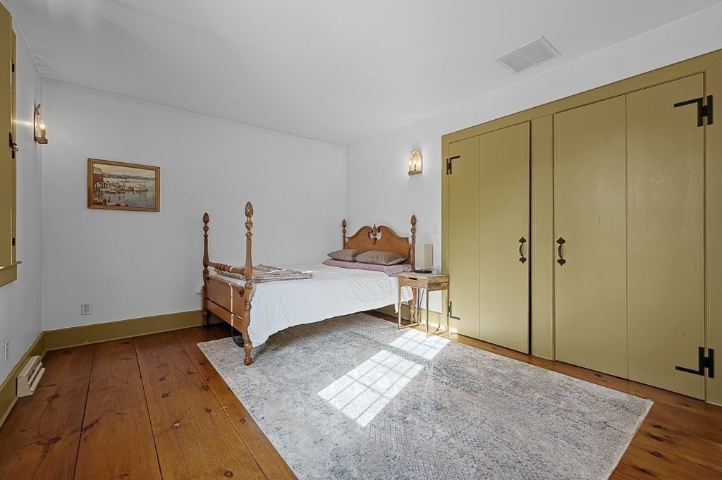 2 Marie Drive Blackstone, MA 01504 - Photo 27 of 42 a bedroom with a bed and wooden floor