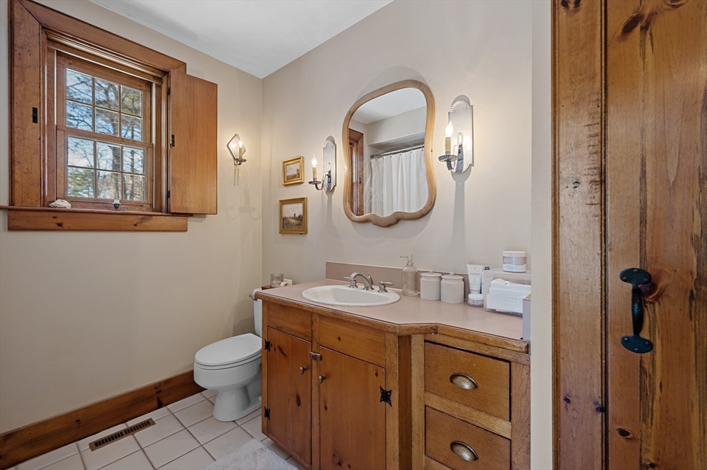 2 Marie Drive Blackstone, MA 01504 - Photo 29 of 42 a bathroom with a toilet sink and mirror