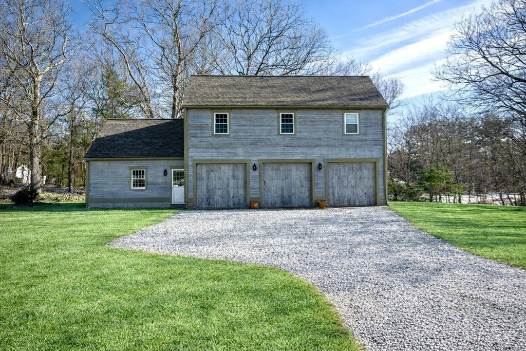 2 Marie Drive Blackstone, MA 01504 - Photo 33 of 42 a front view of a house with a yard and garage