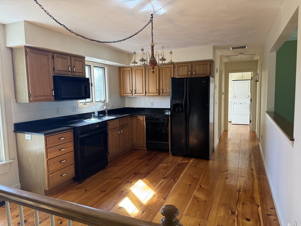 2 Marie Drive Blackstone, MA 01504 - Photo 36 of 42 a kitchen with granite countertop stainless steel appliances a sink and a refrigerator