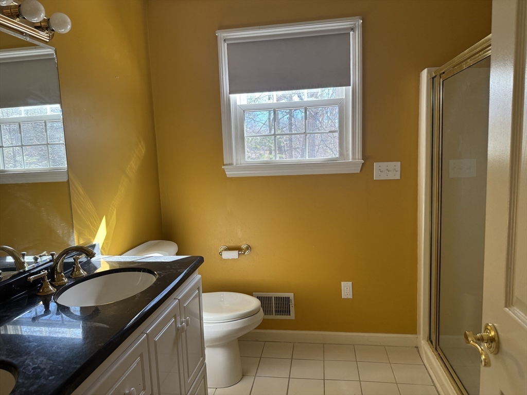 2 Marie Drive Blackstone, MA 01504 - Photo 38 of 42 a bathroom with a sink a toilet and mirror
