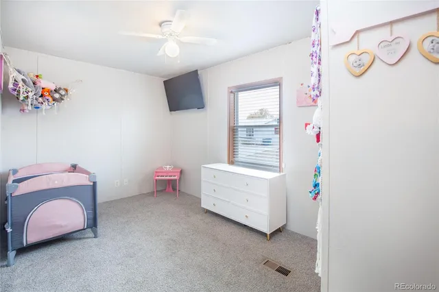 a room with toys and dresser