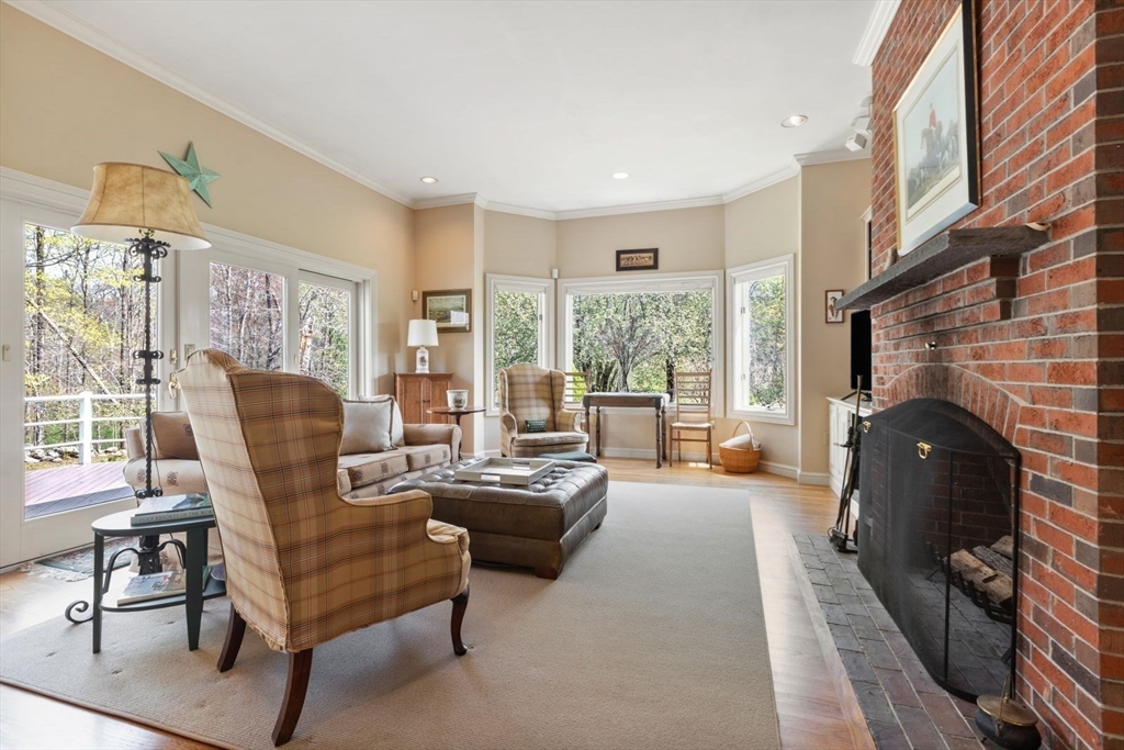 114 Farm Street Dover, MA 02030 - Photo 13 of 40 a living room with furniture and a fireplace