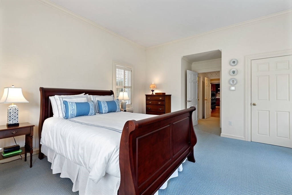 114 Farm Street Dover, MA 02030 - Photo 18 of 40 a bed room with bed and a night stand