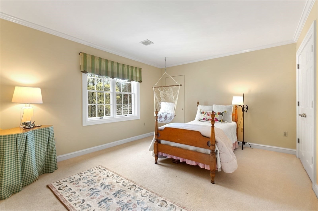 114 Farm Street Dover, MA 02030 - Photo 25 of 40 a bedroom with a bed and a window