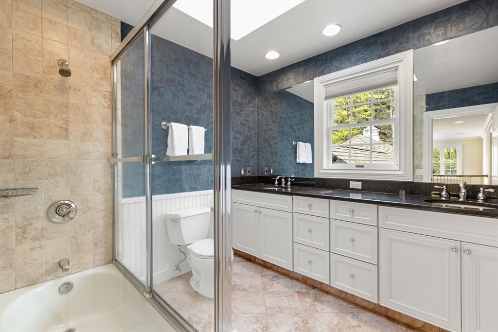 114 Farm Street Dover, MA 02030 - Photo 26 of 40 a bathroom with a granite countertop sink a toilet and bathtub