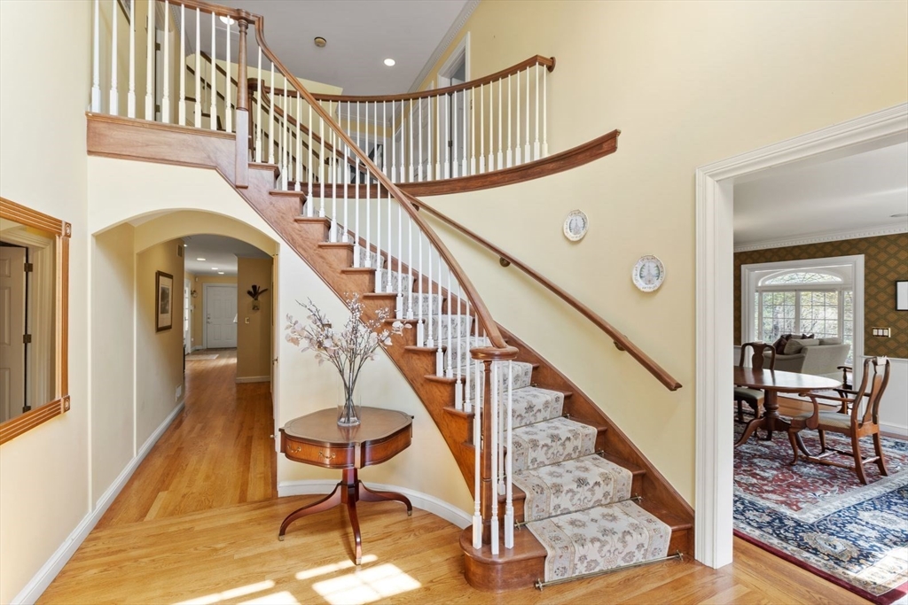 114 Farm Street Dover, MA 02030 - Photo 6 of 40 a view of staircase with railing and a rug