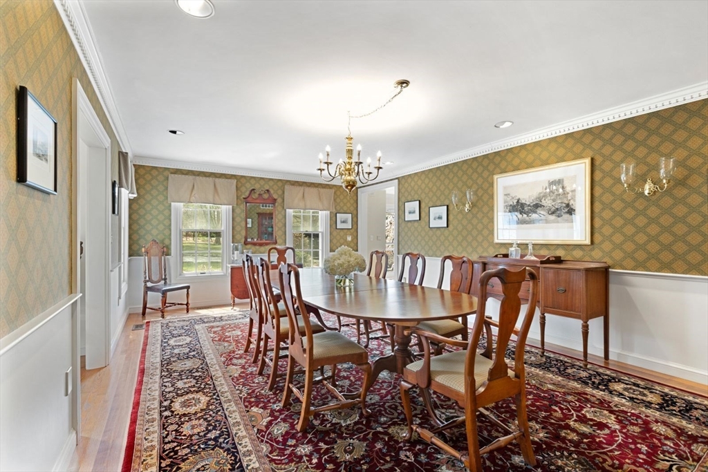 114 Farm Street Dover, MA 02030 - Photo 8 of 40 a view of a dining room with furniture window and wooden floor