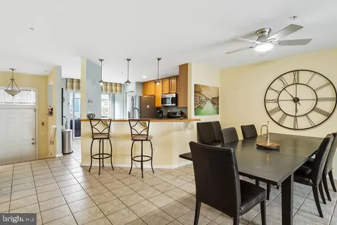 a view of a dining room with furniture and a chandelier