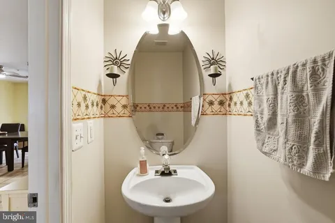 a bathroom with a sink and mirror