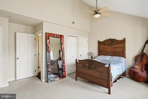 a bedroom with a bed and a walk in closet
