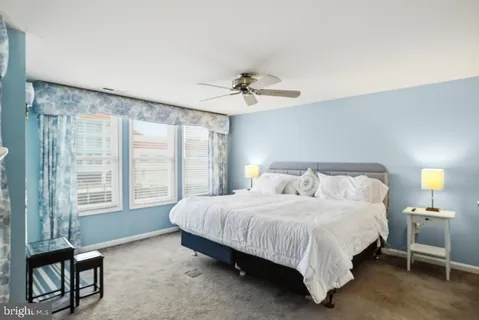a bedroom with a bed and a table in it