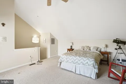 a bedroom with a bed and a cabinets