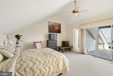 a bedroom with a bed and a desk