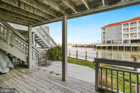 a view of a balcony with wooden floor