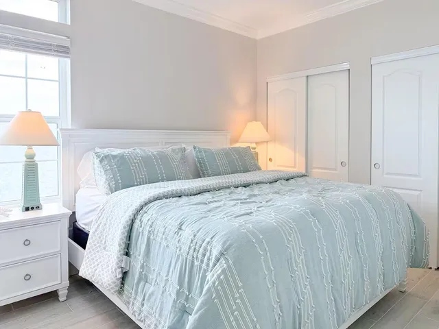 a bathroom with a toilet a sink a mirror and vanity