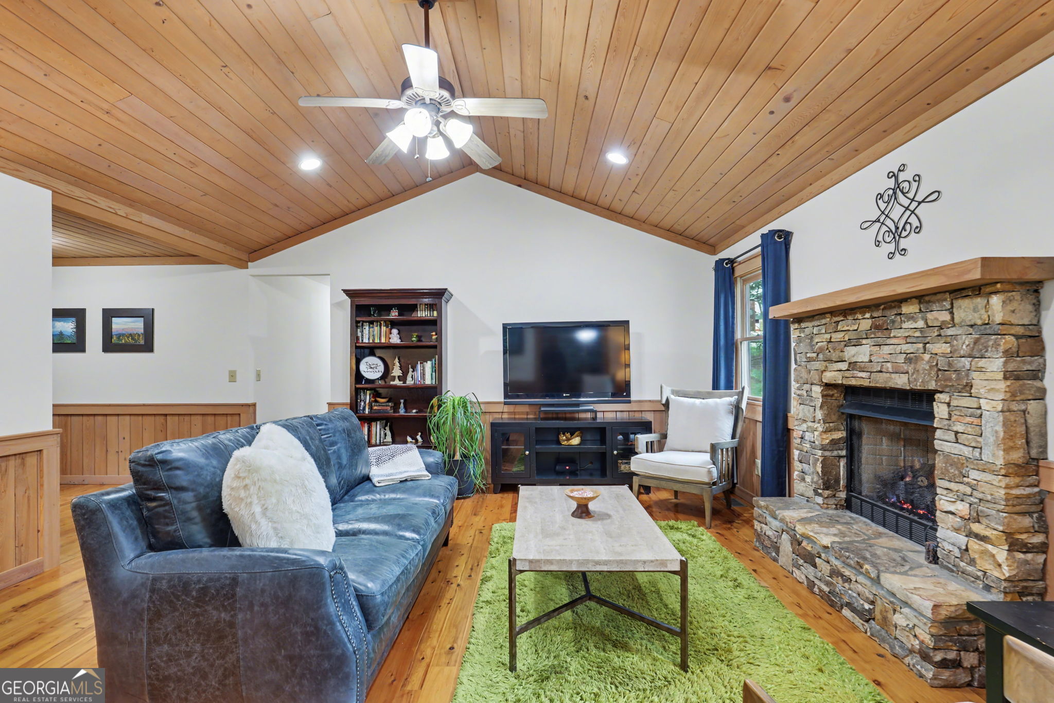 18 Saga Mountain Road Tiger, GA 30576 - Photo 11 of 33 a living room with furniture a flat screen tv and a fireplace