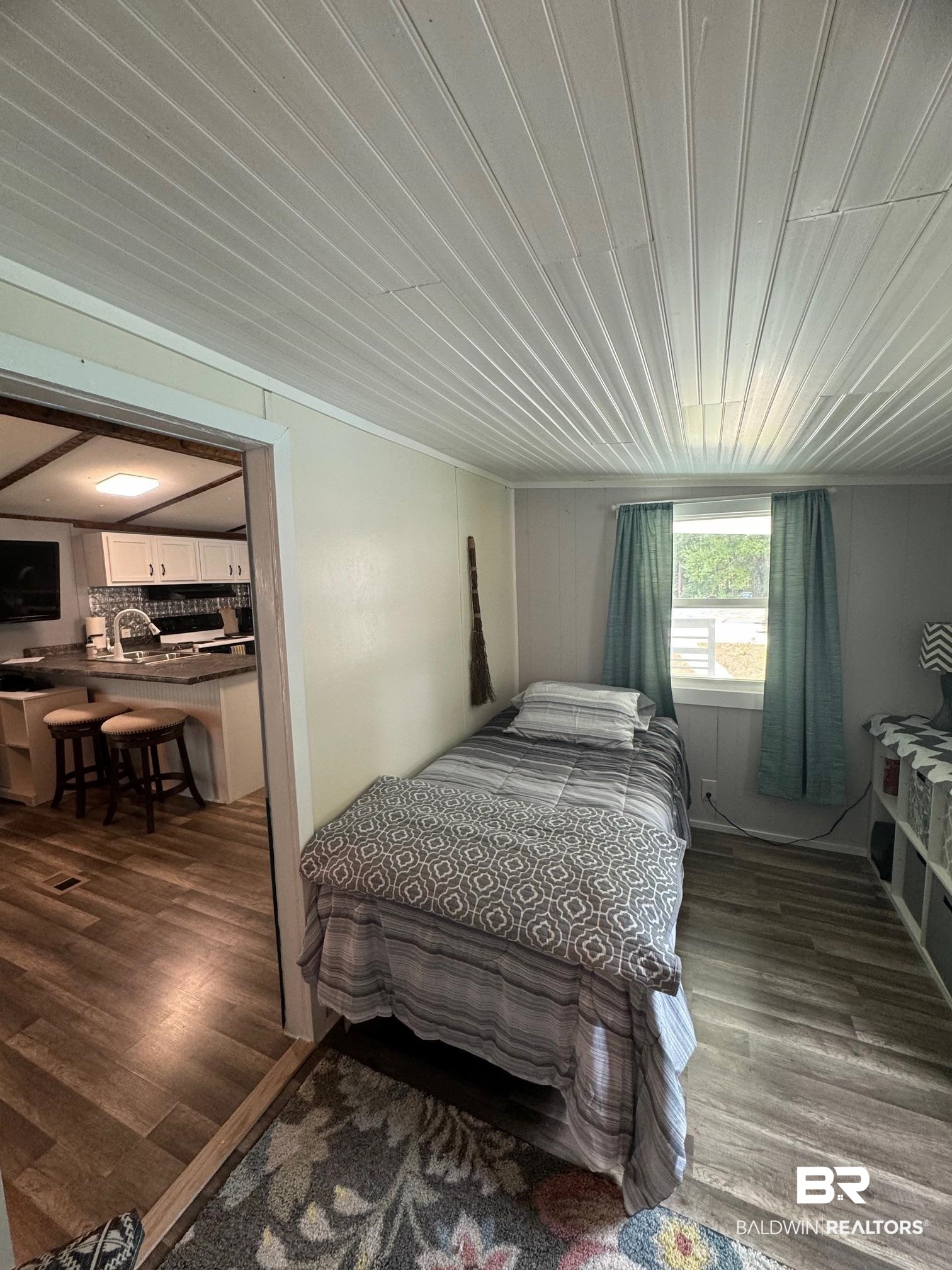 1420 Ridgewood Circle Lillian, AL 36549 - Photo 12 of 41 Bedroom featuring hardwood / wood-style floors