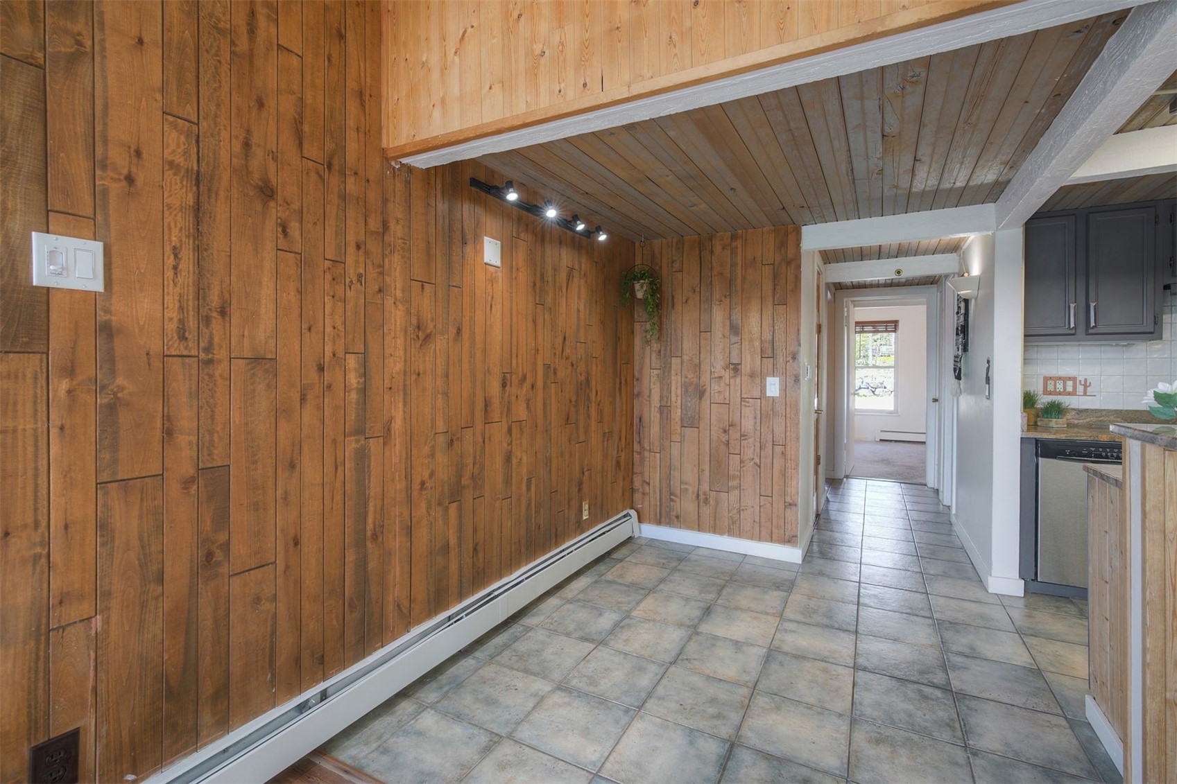 7031 Ryan Gulch Road, Unit 301 Silverthorne, CO 80498 - Photo 13 of 37 a view of a hallway with wooden shelves