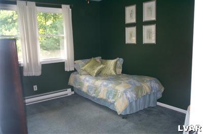 19 Balson Road Stroudsburg, PA 18360 - Photo 10 of 17 a bed sitting in a bedroom next to a window