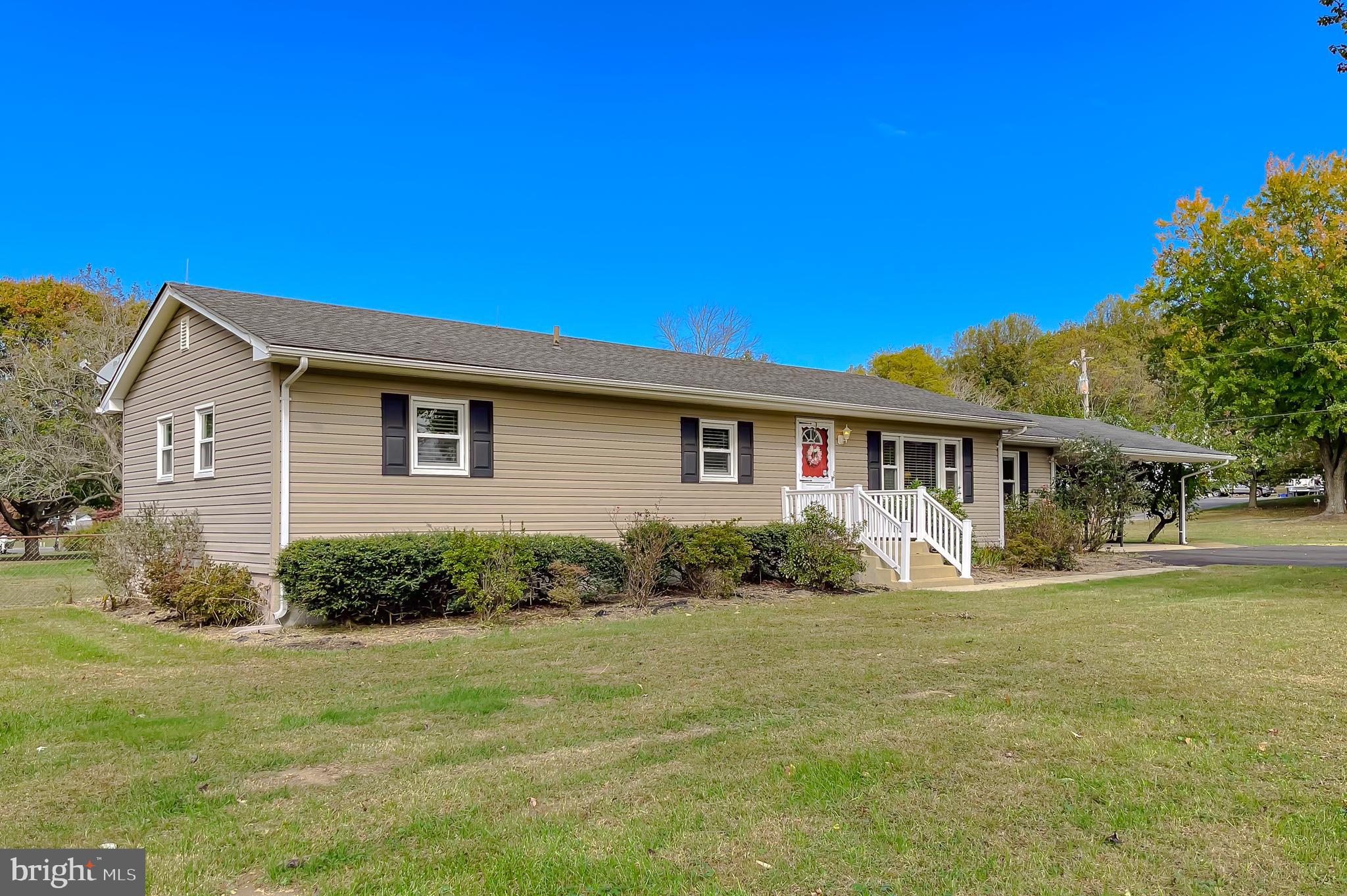 3345 Ferry Landing Road Dunkirk, MD 20754 - Photo 3 of 64 a front view of a house with a yard