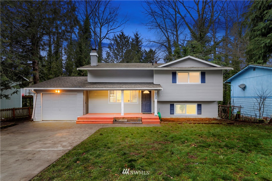 18433 126th Place Southeast Renton, WA 98058 - Photo 1 of 22 a front view of a house with a yard and garage