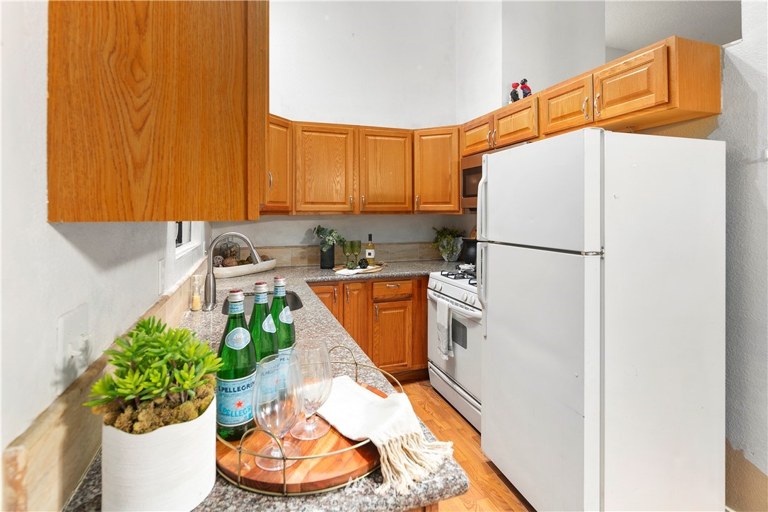 18433 126th Place Southeast Renton, WA 98058 - Photo 12 of 22 a utility room with multiple dryer and flower