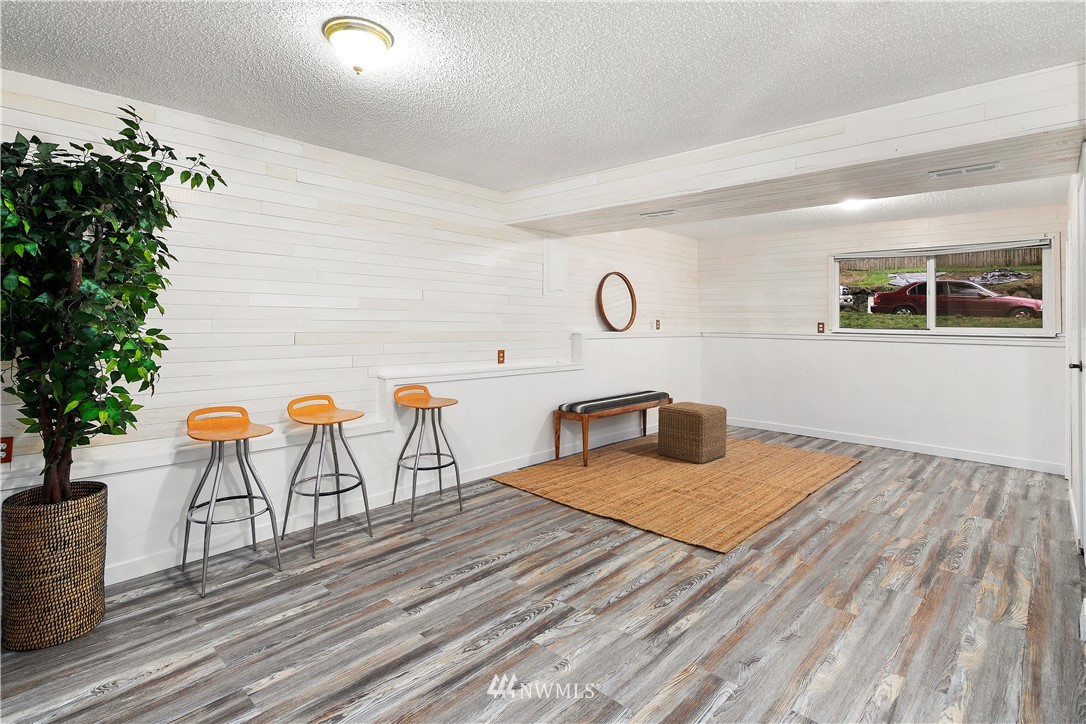 18433 126th Place Southeast Renton, WA 98058 - Photo 16 of 22 a bedroom with a bed and a table