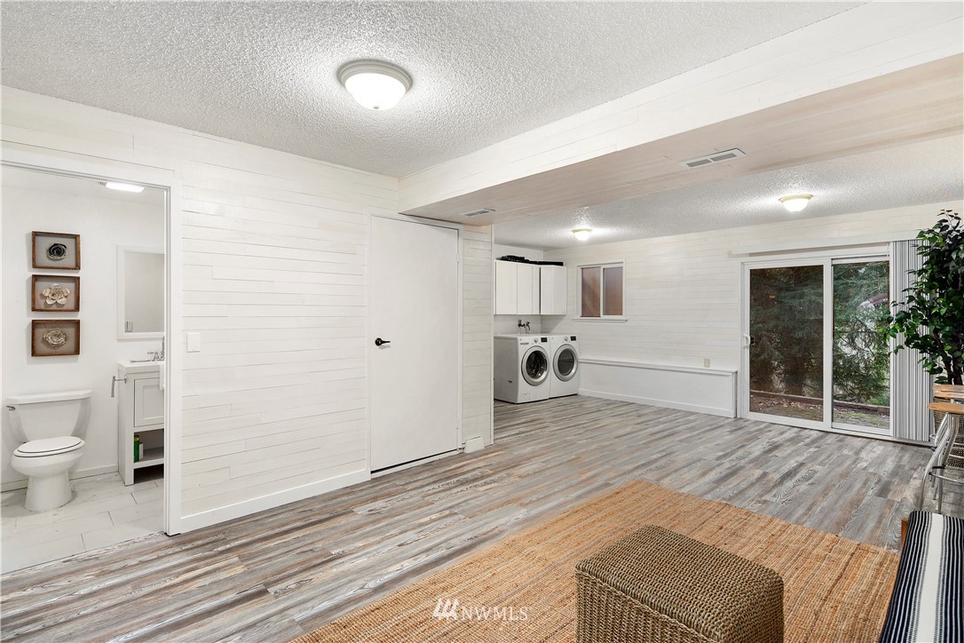 18433 126th Place Southeast Renton, WA 98058 - Photo 17 of 22 a spacious bedroom with a bed and a view of bathroom