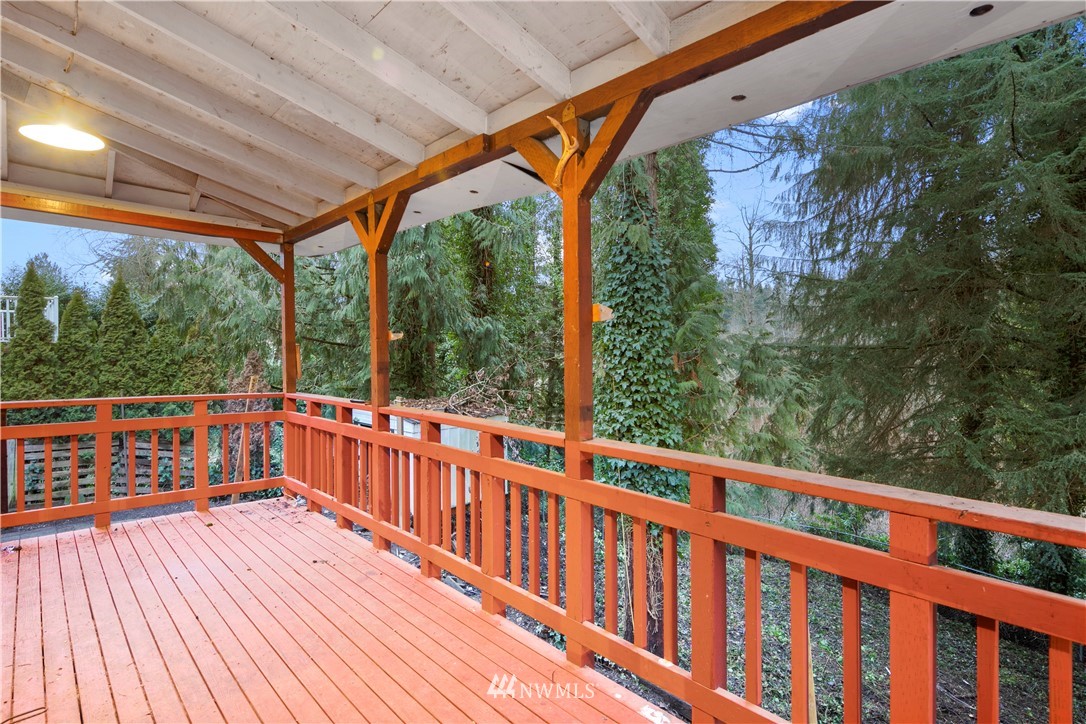 18433 126th Place Southeast Renton, WA 98058 - Photo 22 of 22 a view of roof deck with wooden floor and fence