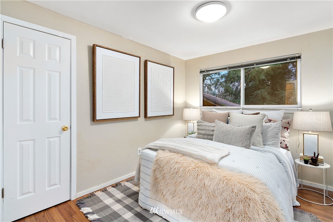 18433 126th Place Southeast Renton, WA 98058 - Photo 8 of 22 a bed room with a bed and a large window