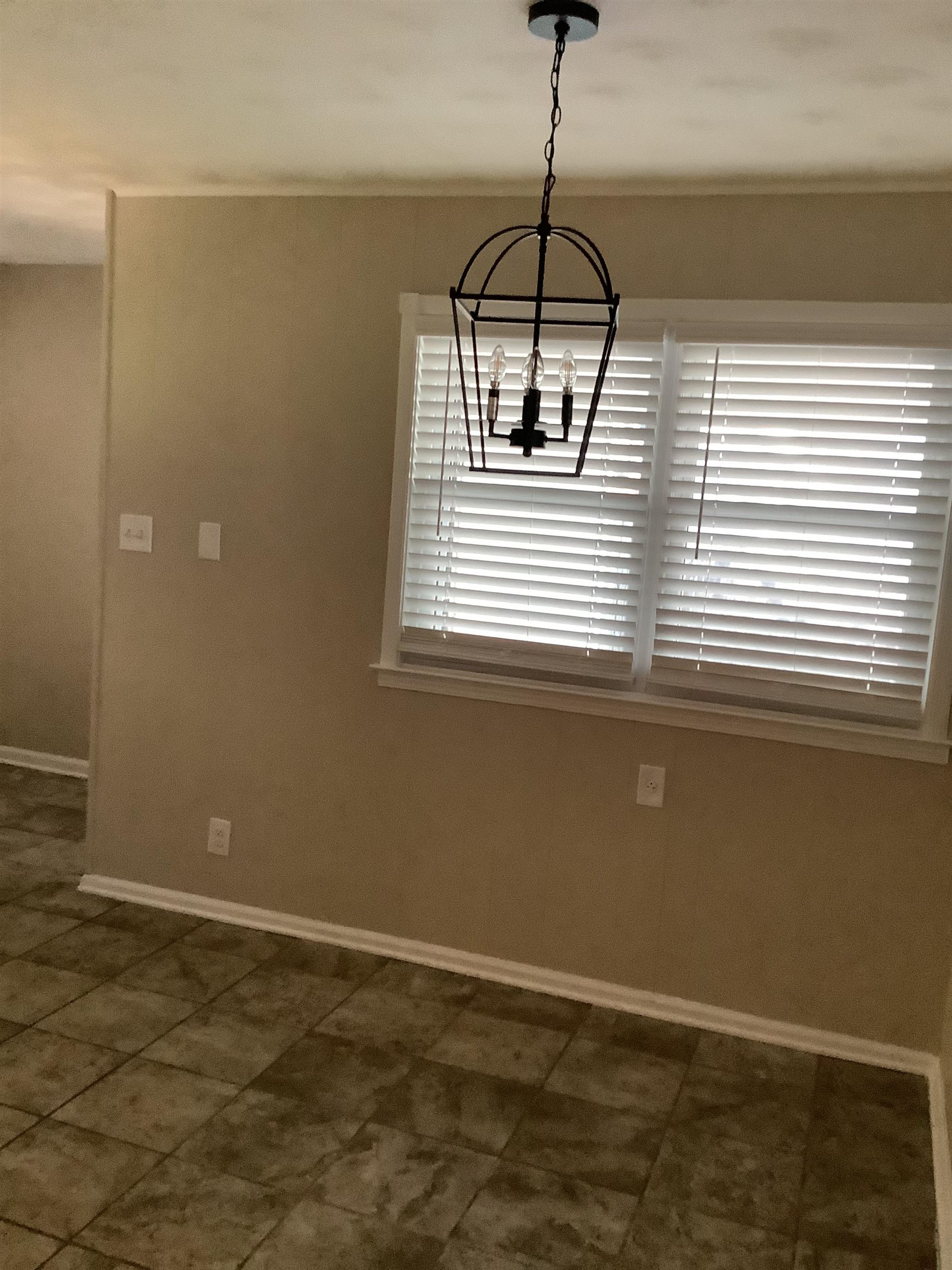 4179 Riche Road Memphis, TN 38128 - Photo 13 of 14 Unfurnished dining area with an inviting chandelier