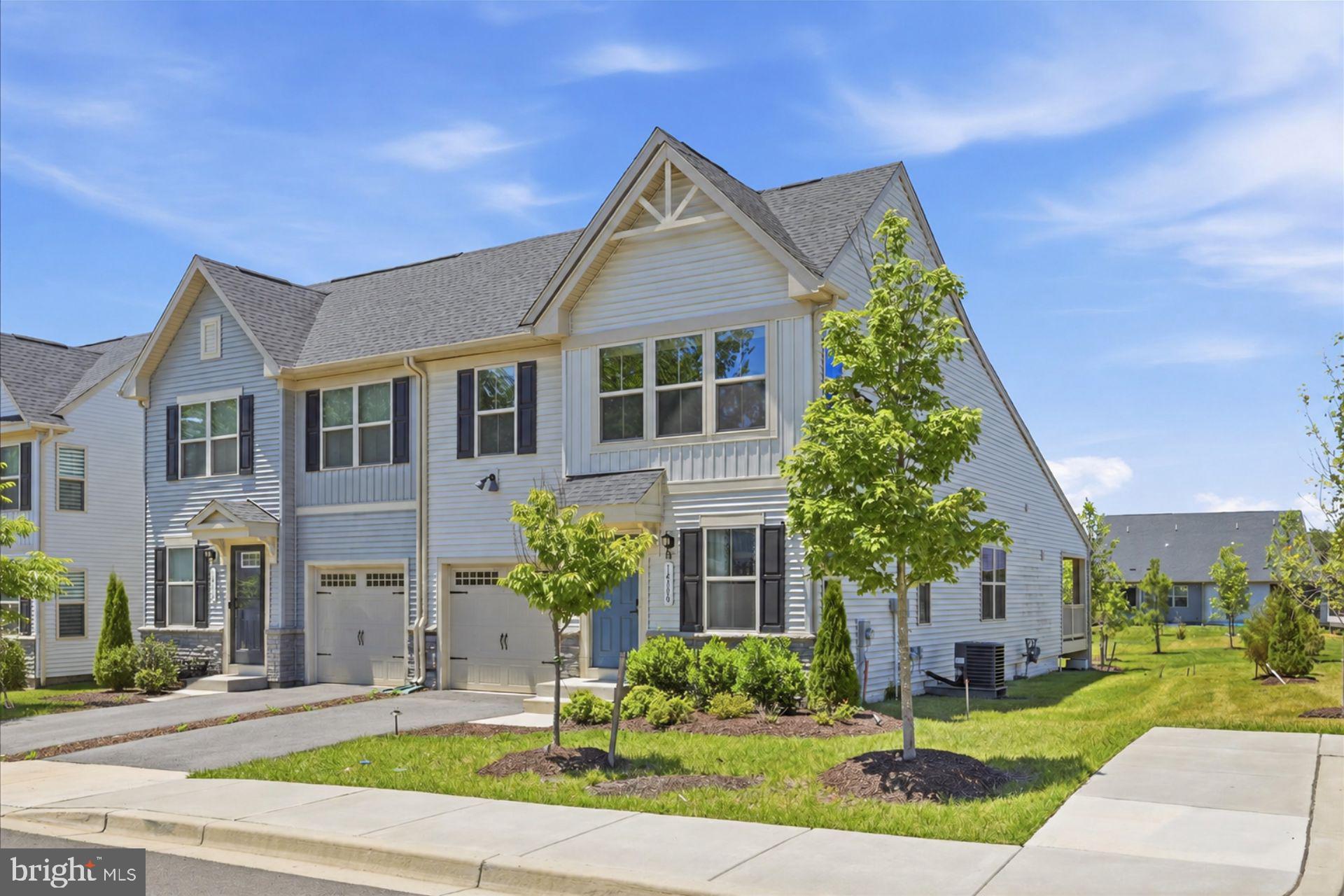14380 Longhouse Loop Brandywine, MD 20613 - Photo 19 of 20 front view of a house with a yard