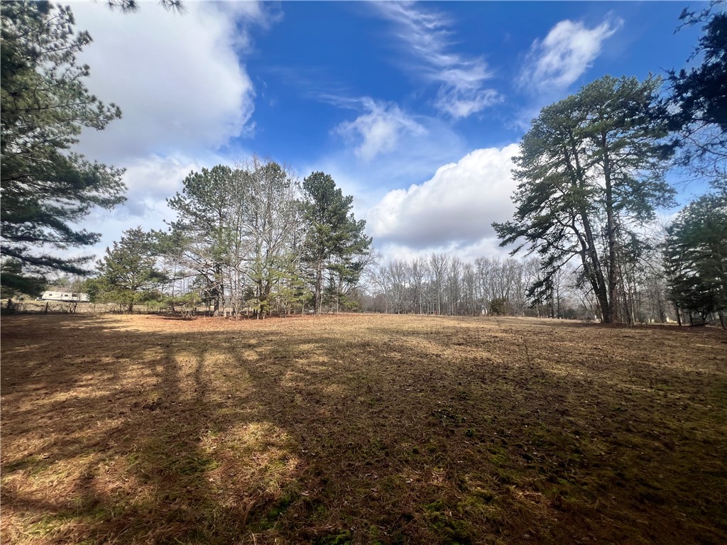 6980 Midway Road Pelzer, SC 29669 - Photo 12 of 15 Expansive green space offers abundant opportunities for outdoor enjoyment.
