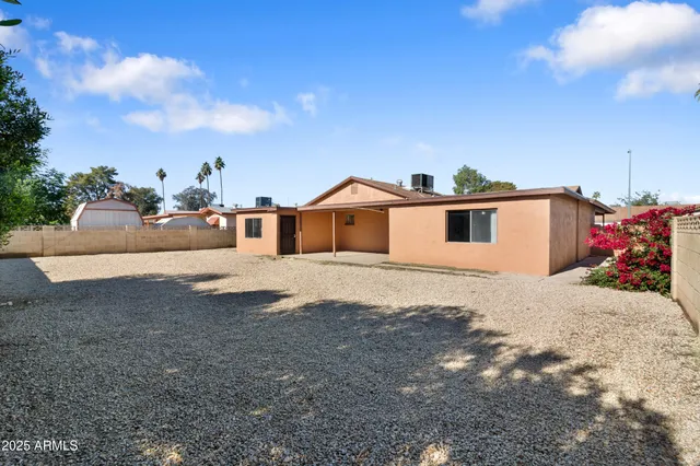 a view of a house with a snow on the road