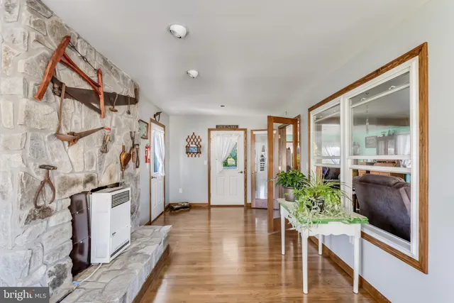 a view of a livingroom with furniture and refrigerator